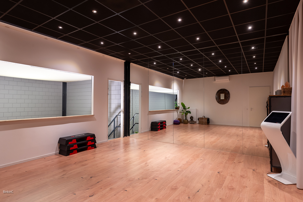 Interieurfotografie fitness ruimte met spiegel